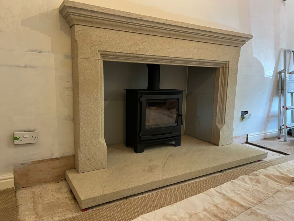large textured sandstone fireplace